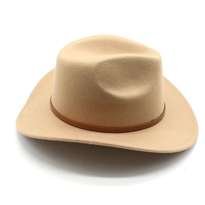 Detailed view of beige western cowboy felt hat with brown leather decorative band