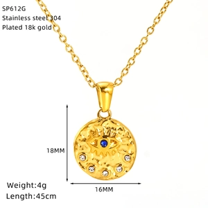Detail of 18k gold plated stainless steel evil eye pendant with blue gem and white zircon