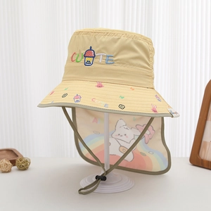 Close-up of yellow sun hat featuring cute rabbit patterns and adjustable wind cord