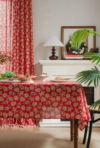 Detailed view of red Christmas gingerbread man and snowflake patterns on cotton linen fabric
