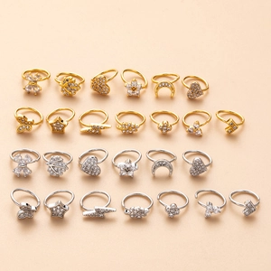 26-piece gold and silver copper nose ring set featuring flower and butterfly zirconia designs