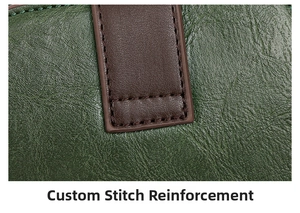Close-up of deep green pebbled leather texture with brown reinforced stitching details