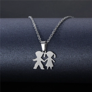 Polished stainless steel boy and girl silhouette pendant necklace on a jewelry display