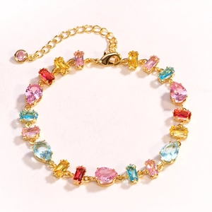 Detail of multi-color gemstone bracelet with adjustable gold chain and lobster clasp