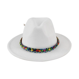 Close-up of white felt fedora hat featuring colorful beads and woven bohemian strap decoration