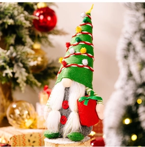 Detailed close-up of a Christmas gnome doll with a green striped hat on a festive background