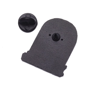 Detail of the black matte alloy back of the punk tombstone pin with rubber clutch back