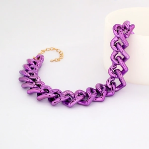 Close-up of shiny purple link chain with golden metal extender for pets fashion jewelry