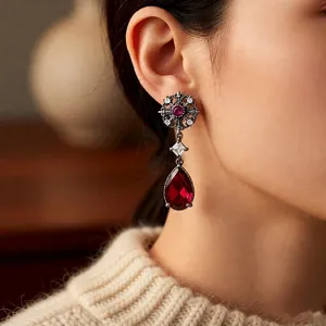 Vintage palace style silver needle drop earrings with red zircon stones and floral pendant