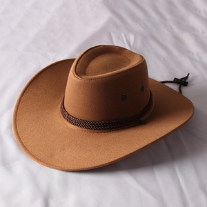Detail of brown felt cowboy hat with braided leather band and adjustable chin strap