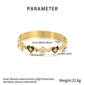 Detailed view of 18K gold plated clover bangle with size specs 58x51mm and weights 22.8g