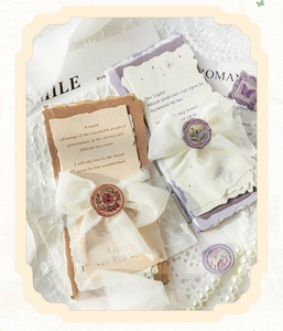 Flat lay of vintage scrapbooking stickers with lace, pearls, and decorative resin seals