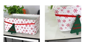 Detail view of red Oxford cloth storage basket with snowflake pattern and festive tag