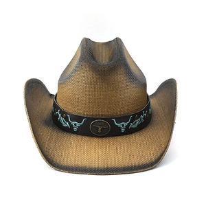 Detail of woven cowboy hat featuring bull head embroidery and vintage metal emblem