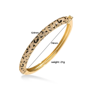 Detail of leopard print bangle with black enamel, stones, and 6.4mm width dimensions