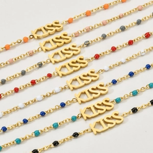 Colorful stainless steel KISS bracelets featuring vibrant enamel beads and gold plating