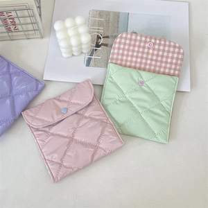 Quilted glossy mini storage pouches in pastel colors with heart-shaped snap closure