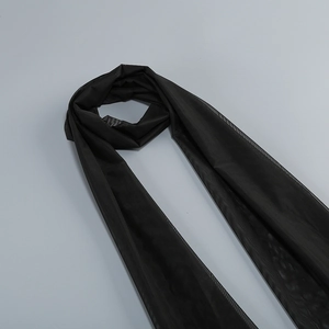 Detail view of the lightweight black translucent mesh shawl for evening gowns