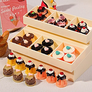 Miniature resin vanilla chocolate cakes and dollhouse pudding sets in a display box