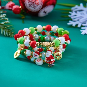 Christmas beaded bracelet set with Santa Claus charm and snowflake pendant in red and green