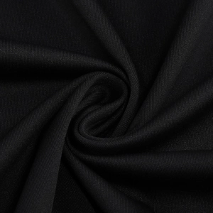 Macro detail of high-quality black knitted fabric texture with elegant drapes and soft sheen