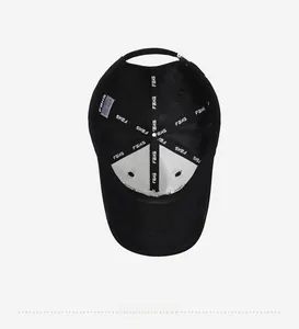 Detailed interior of a black cotton baseball cap showing reinforced seams and logo tape