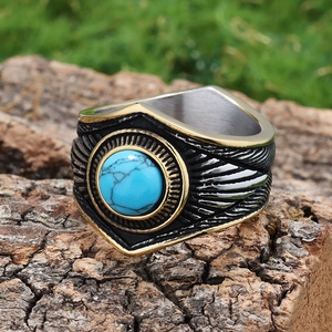 Vintage stainless steel ring with turquoise star design on a rustic wood bark backdrop