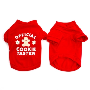 Detail of red Christmas dog shirt with Official Cookie Taster print and gingerbread pattern