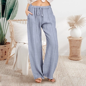 Detail view of light blue wide-leg casual pants with elastic drawstring waist and side pockets
