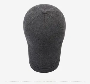 Detailed top view of a charcoal gray wool blend winter baseball cap with metal logo