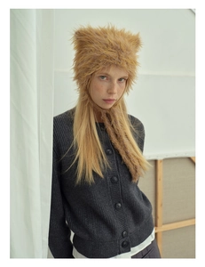 Detail of caramel faux fur cat ear hat and charcoal knit cardigan for winter style