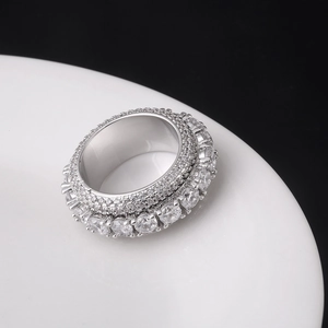 Macro shot of silver hip-hop spinner ring with five rows of pavé-set cubic zirconia stones
