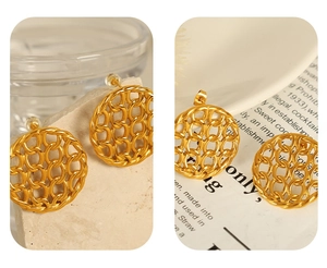 Detailed view of gold plated titanium earrings with round mesh cutout and chain texture
