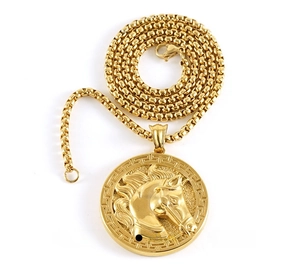 Macro detail of 3D horse head relief pendant with greek key border on gold box chain