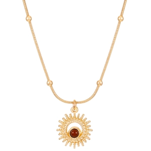 Detail of gold snake chain necklace featuring a sun pendant with a brown tiger eye stone