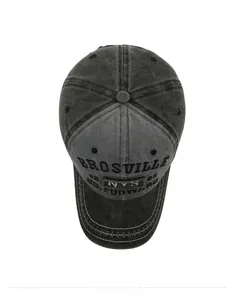 Top view of washed denim baseball cap with vintage embroidery and cross-stitch brim