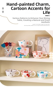 Detail of hand-painted ceramic wave mugs and heart spoons in a gift set packaging