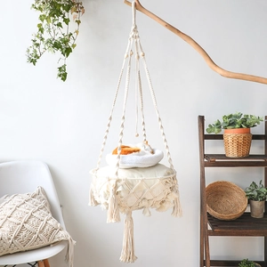 Bohemian style woven cotton rope cat hammock bed with tassel accents for home decor