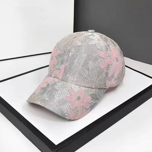 Lace mesh baseball cap featuring pink floral embroidery and breathable sun protection