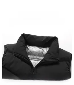 Detail of stand-up collar on black winter vest featuring silver honeycomb heat lining