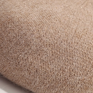 Macro view of oatmeal rabbit hair knit beret with sparkling gold metallic threads