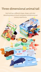 Close-up of 3D sensory animal tails on soft fabric baby books for early learning