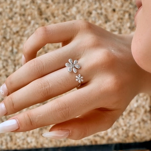 Detailed view of S925 sterling silver ring with sparkling zircon double flower design