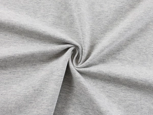 Detailed macro view showing the soft texture and drape of grey cotton knit fabric
