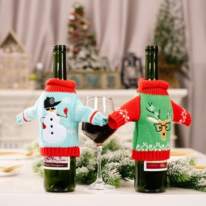 Christmas knitted wine bottle covers with snowman and reindeer patterns for holiday decor