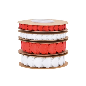 Detail showing four rolls of red and white heart-patterned satin ribbons in two sizes