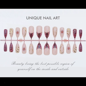 Detailed set of Y2K crocodile pattern press-on nails with gold beads and floral art
