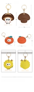 Detail view of cartoon fruit keychain charms with dimensions and built-in vanity mirrors