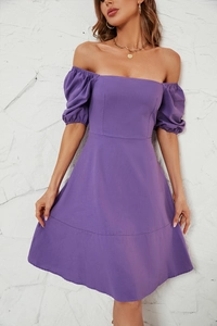 Close-up detail of the purple puff sleeves and square neckline on this summer dress