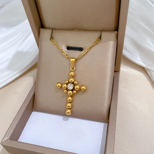 Minimalist gold titanium steel necklace with beaded cross pendant and sparkling zircon